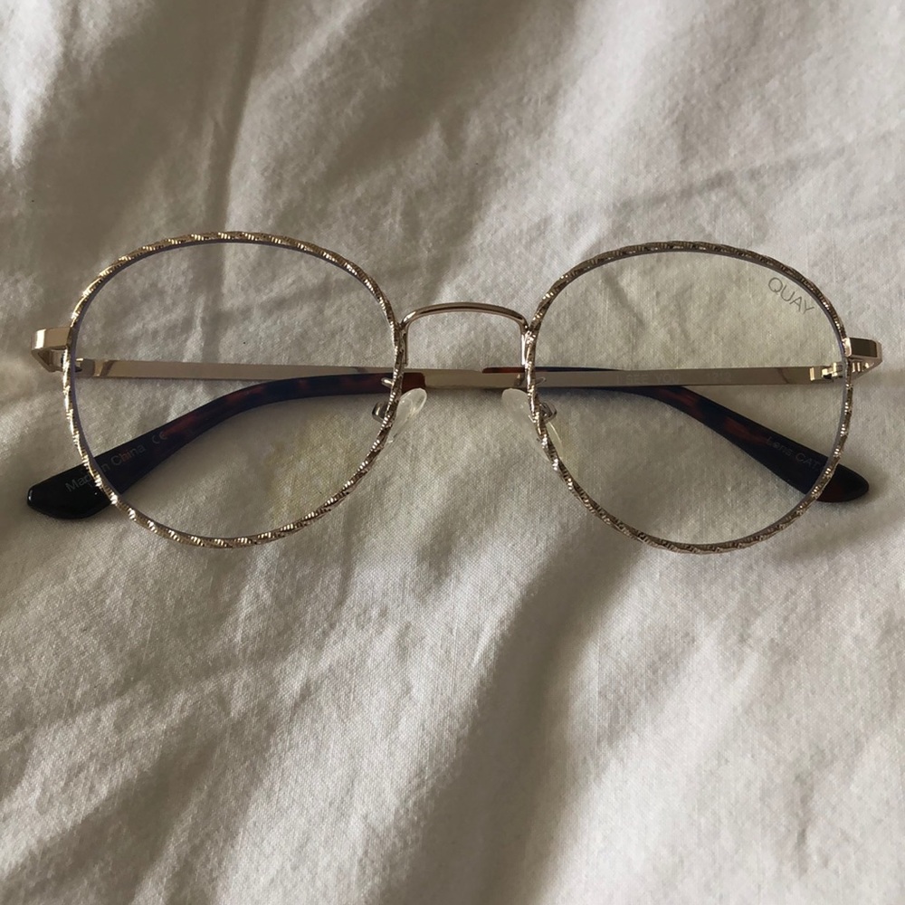 Clear sunglasses with gold trim